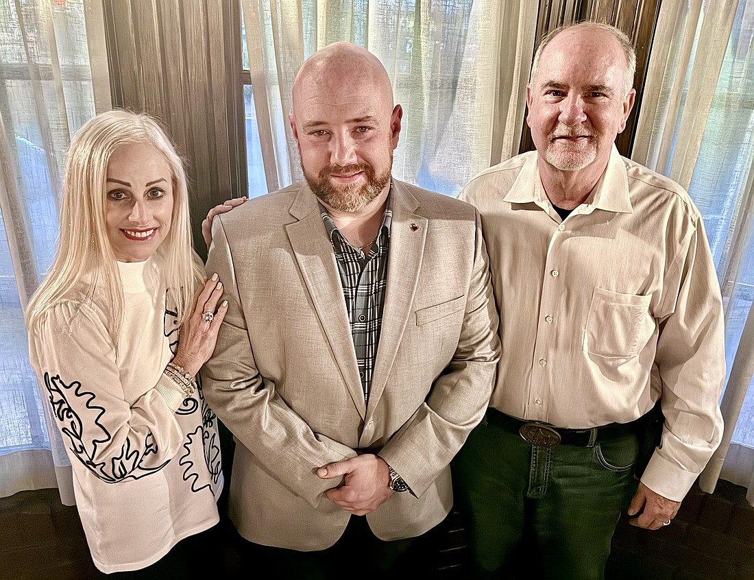 Former Ormond Beach City Commissioner Susan Persis, Flagler County Sheriff's Office Deputy Joe Oliva, Jr., and Flagler County Sheriff Rick Staly. Courtesy photo