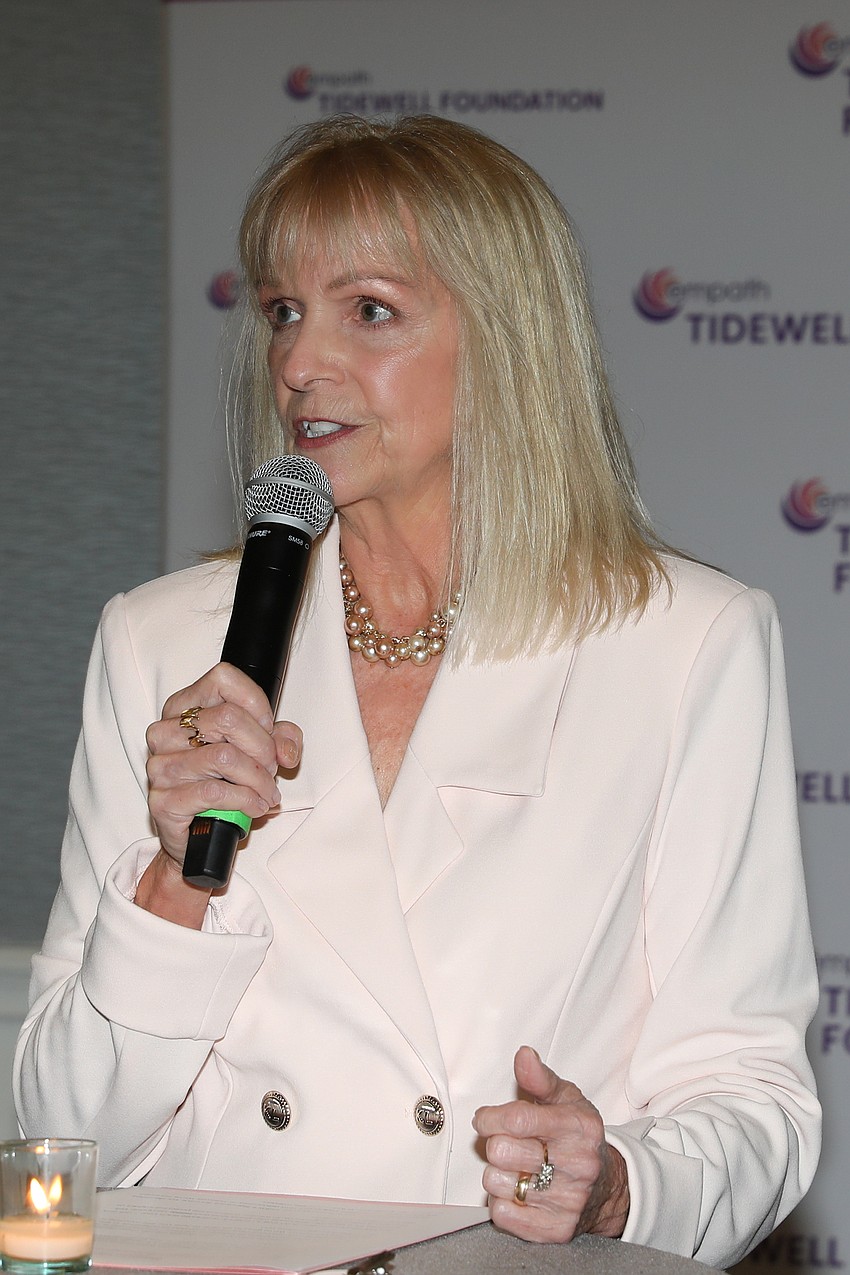 Jan Miller greets guests at the VIP event held before lunch.