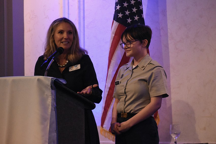 Teen Court CEO Heather Todd introduces scholarship recipient Megan Carroll.