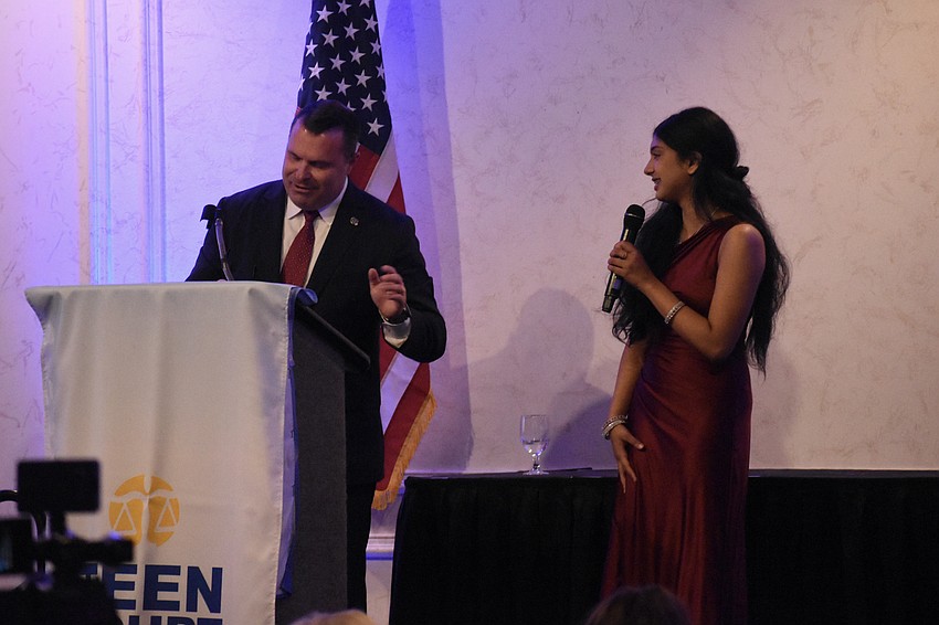 Event Chair Patrick Robinson welcomes speaker Niya Bobban.