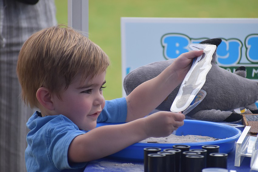 Bentley Kuiper, 2, enjoys the sand.
