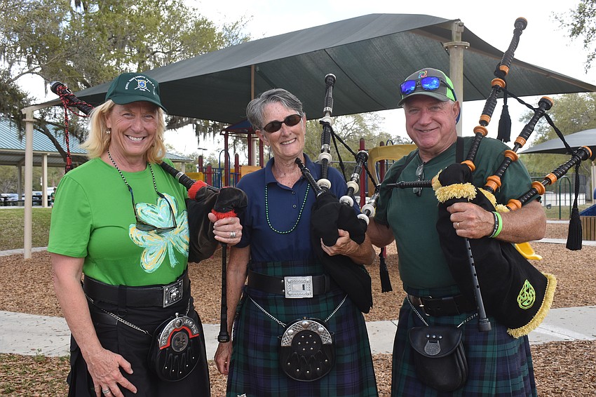 Leslie Jones, Brigid Flannery and Michael Urquhart are members of the Sarasota based band Lion Rampant Pipes and Drums. They led the Lucky Dog Parade in song.