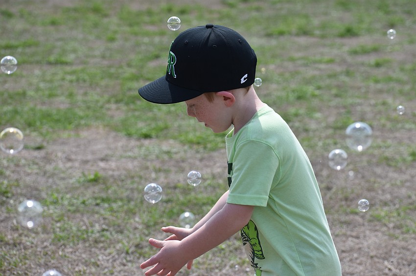 Lakewood Ranch's Jayce Cox, 4, chases bubbles at the Irish Celtic Festival because he 