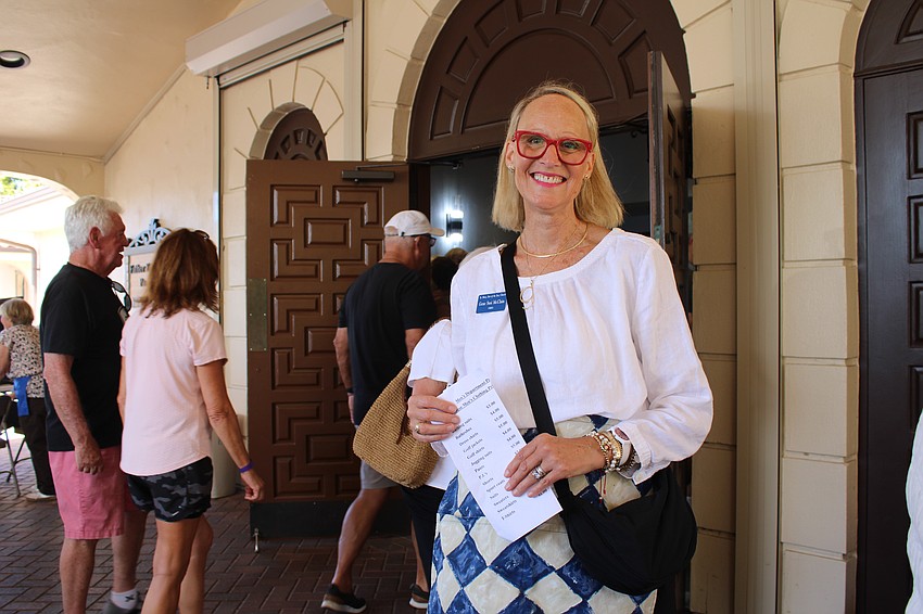 Gene Susi McClain greets incoming shoppers at the Royal Rummage Sale on March 6 at St. Mary, Star of the Sea, Catholic Church.