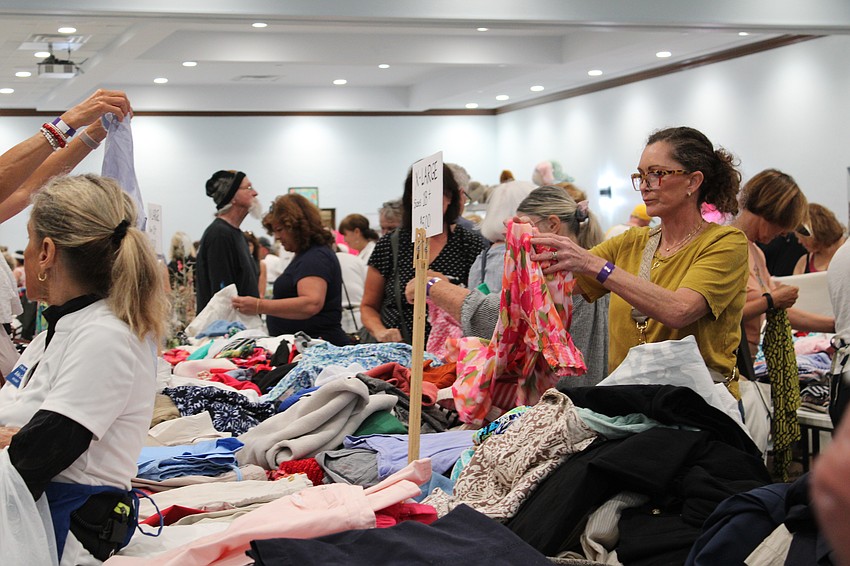 Shoppers were browsing elbow-to-elbow at the early bird Royal Rummange Sale.