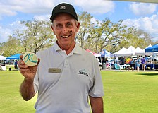 Mark Daunt from The Resort at Longboat Key Club doles out a sweet pick-me-up from the organization’s booth at the 3rd annual Town of Longboat Key Open House on March 7 at the Town Center Green.