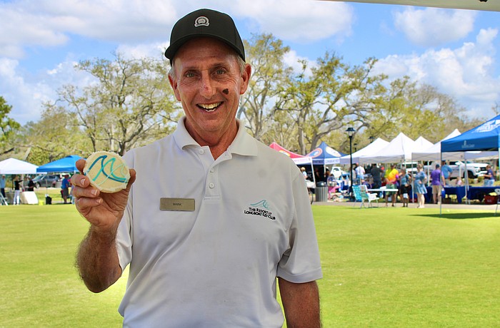 Mark Daunt from The Resort at Longboat Key Club doles out a sweet pick-me-up from the organization’s booth at the 3rd annual Town of Longboat Key Open House on March 7 at the Town Center Green.