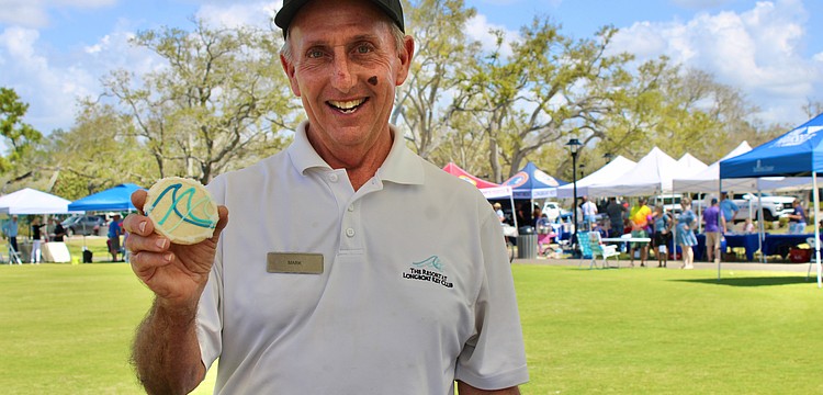 Mark Daunt from The Resort at Longboat Key Club doles out a sweet pick-me-up from the organization’s booth at the 3rd annual Town of Longboat Key Open House on March 7 at the Town Center Green.