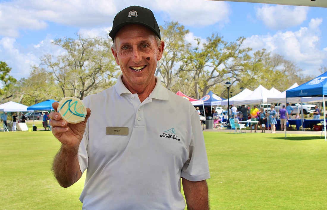 Mark Daunt from The Resort at Longboat Key Club doles out a sweet pick-me-up from the organization’s booth at the 3rd annual Town of Longboat Key Open House on March 7 at the Town Center Green.