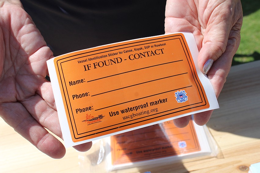 Marsha Grogan from the U.S. Coast Guard Station in Cortez encourages kayakers to ensure their vessel has a contact sticker in case it gets lost.