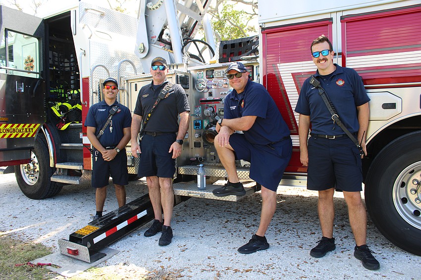 First responders FF/PM Joshua Falcon, Lt. Tim Haas, FF/PM Brent Kruse and Aaron Maness said families attending the Longboat Key open house had fun checking out the rigs.