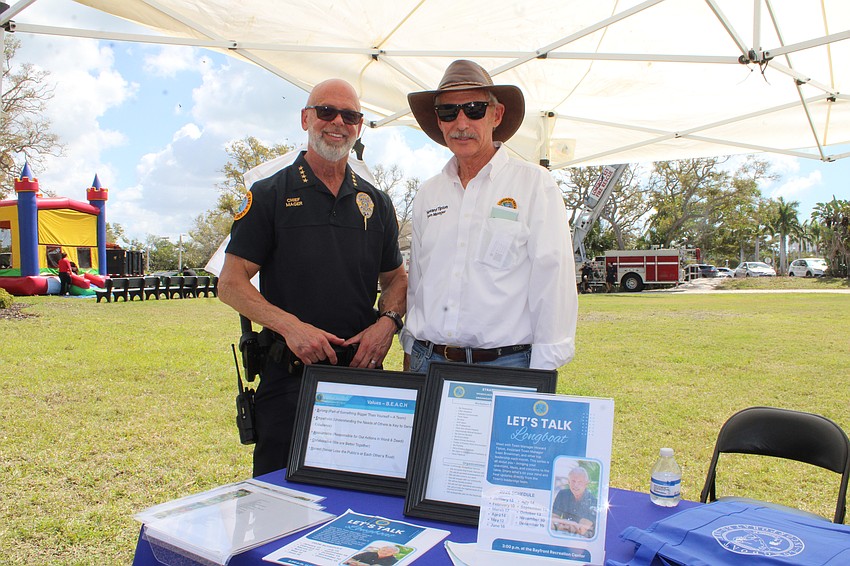 Longboat Police Chief Russ Mager and Town Manager Howard Tipton greet attendees at the town open house.