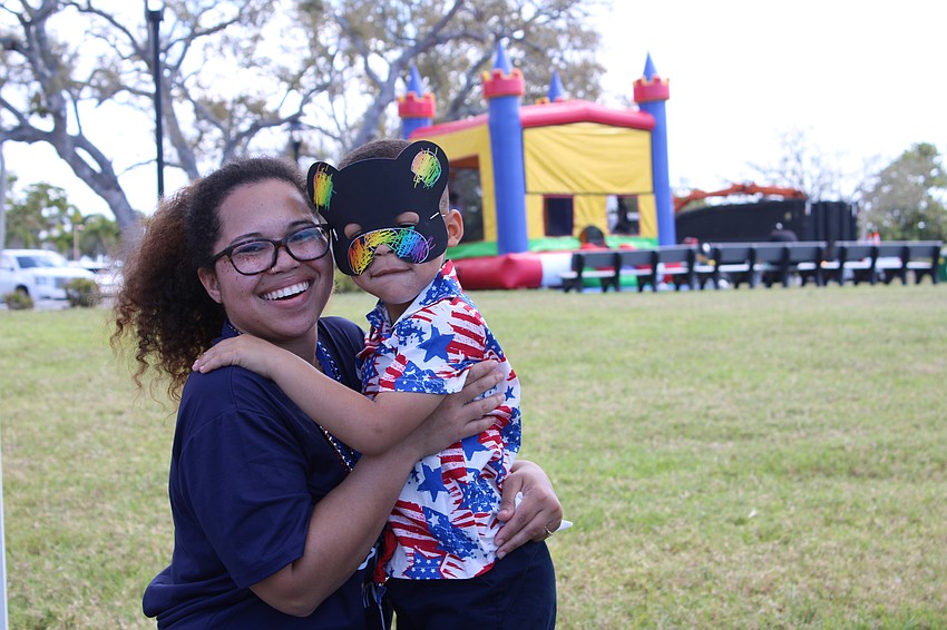 Shereese Yancy and Daesyn Johnson check out all the fun to be had at the Town of Longboat Key open house, with Johnson modeling an expertly crafted face mask.