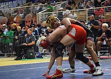 Senior Jaden Morales (top) controls Middleburg junior Nathan Harvey (bottom). The Pirate won their match by decision, 6-4, and ultimately placed sixth at 126 pounds.