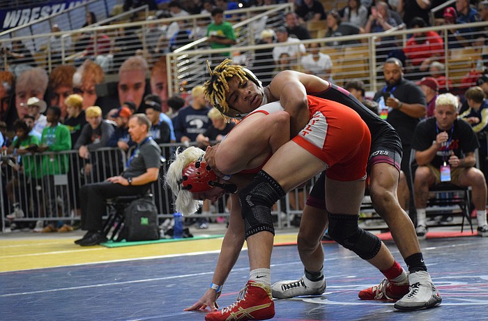 Senior Jaden Morales (top) controls Middleburg junior Nathan Harvey (bottom). The Pirate won their match by decision, 6-4, and ultimately placed sixth at 126 pounds.