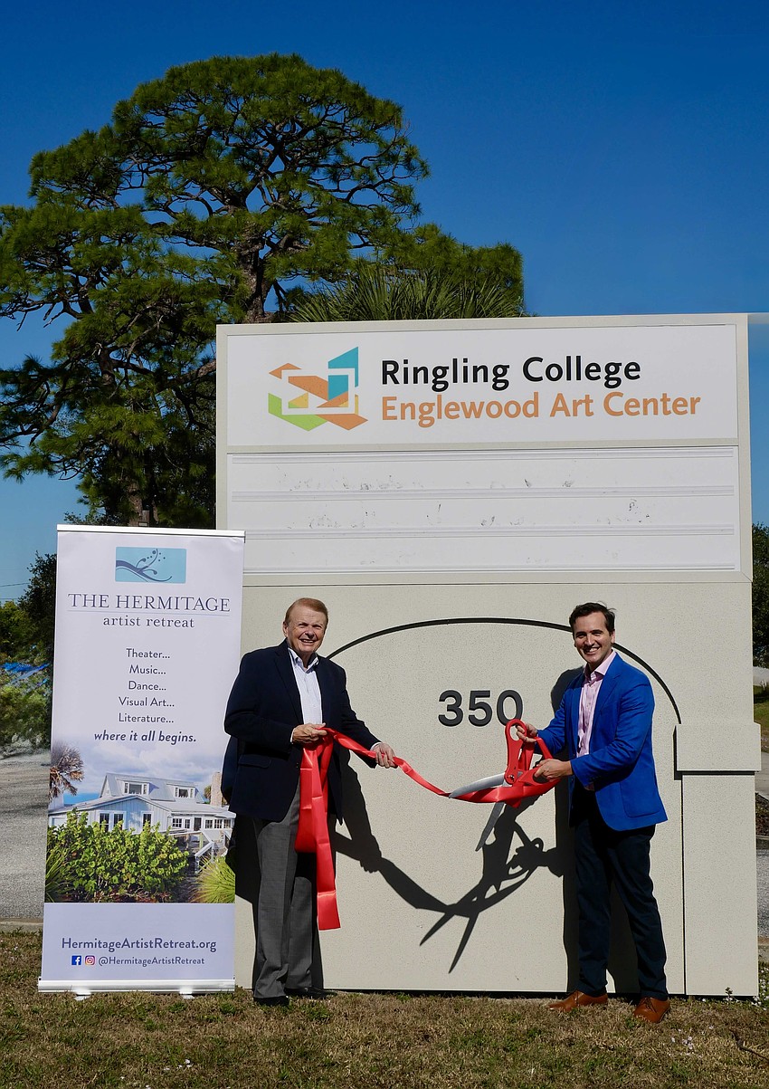 Ringling College President Larry Thompson and Hermitage Artist Retreat CEO Andy Sandberg celebrate the Englewood Art Center's ownership transfer.