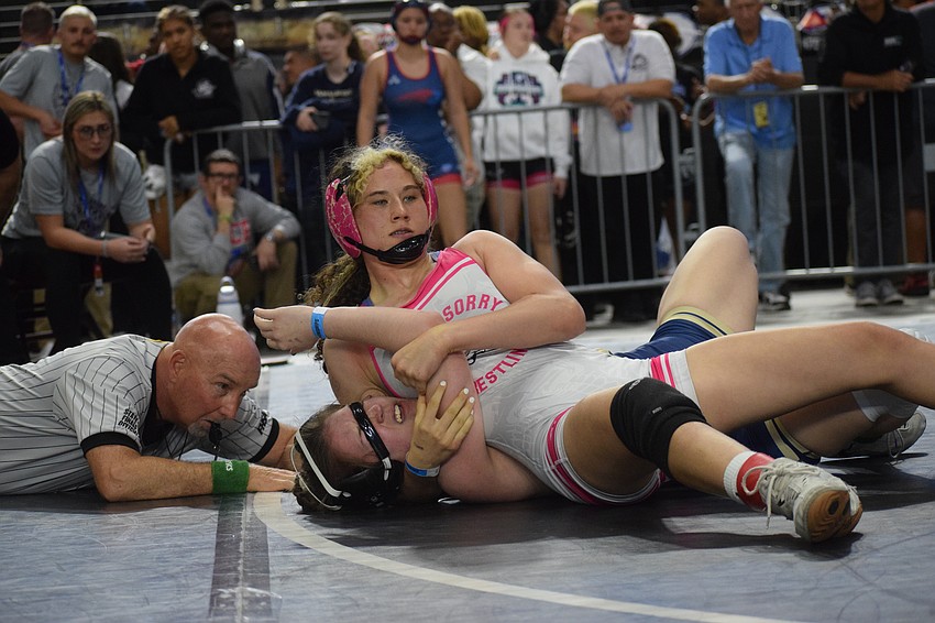 Junior Alexis Hutter (top) wrestles Sandalwood senior Sara Goodman (bottom). She won their match by fall, 3-0, in one minute and 40 seconds en route to sixth place at 135 pounds.