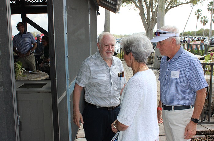 Rex Jensen welcomes Fabienne and Brett Hutchens to the party at the Sarasota Polo Club.
