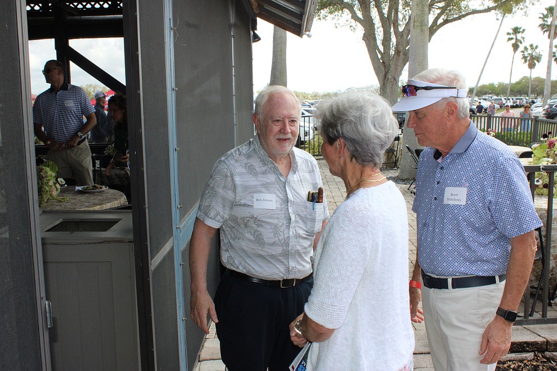 Rex Jensen welcomes Fabienne and Brett Hutchens to the party at the Sarasota Polo Club.