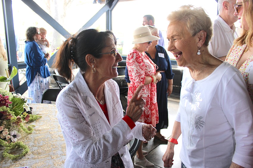 School District of Manatee County Board Member Cindy Spray visits with Country Club East’s Charlotte Madar during SMR’s party at the Sarasota Polo Club.