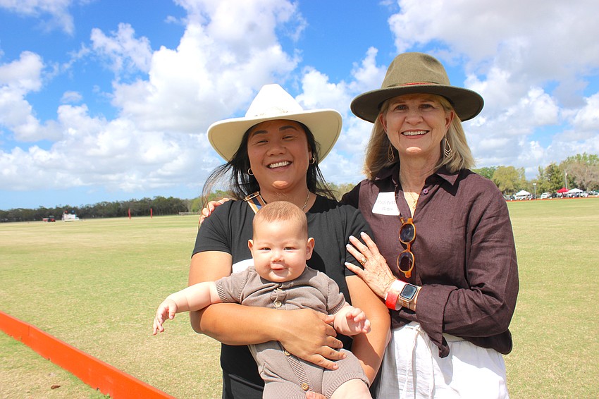 Morgan Bettes Angell holds her baby, James Angell, along with her mom, Patti Peotter Bettes, during SMR’s party at the Sarasota Polo Club.