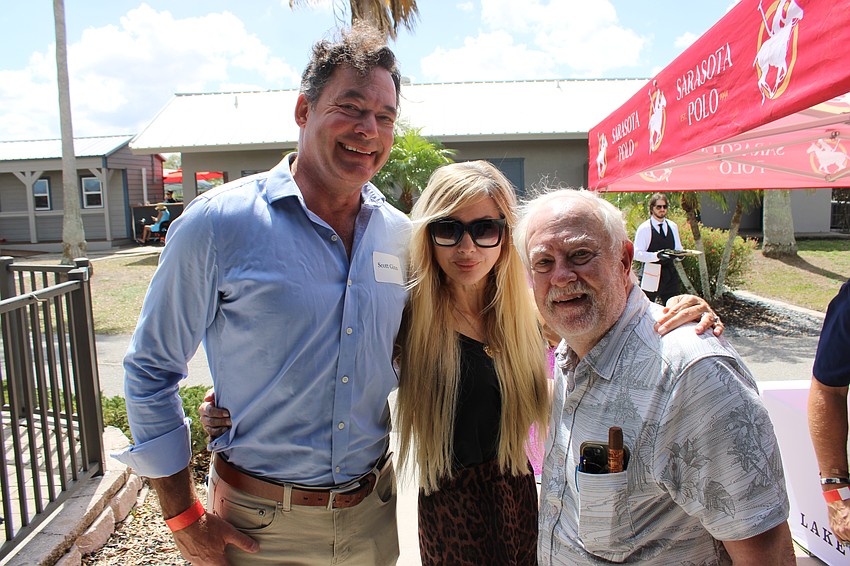 Scott Ginn, Karen Medford and Rex Jensen share a laugh during SMR’s party at the Sarasota Polo Club.
