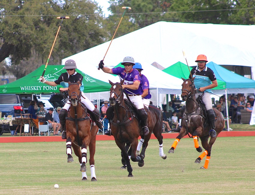 Camille Ricaud of Hillcroft/Investus and Willie Jumet of Avalon Farms have their mallets at the ready during their match March 8 at the Sarasota Polo Club.