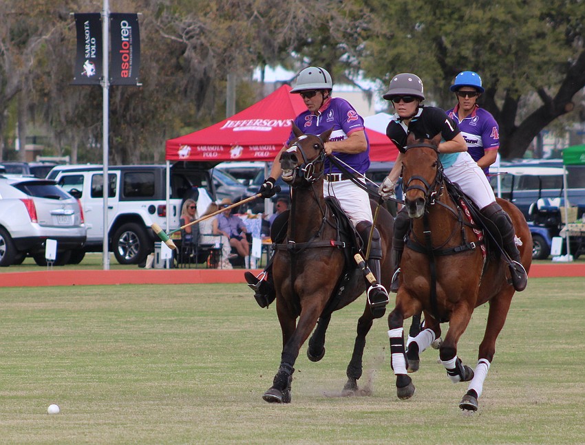 Willie Jumer of Avalon Farms and Camille Ricaud of Hillcroft/Investus give chase during a match at the Sarasota Polo Club March 8.