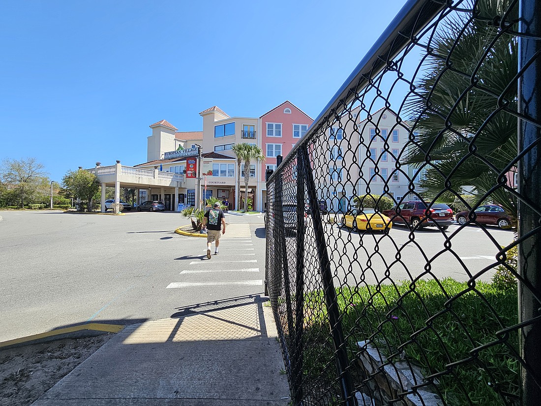 Permanent gates have been installed at European Village's overflow parking after a dispute with the Dunes CDD. Photo by Sierra Williams