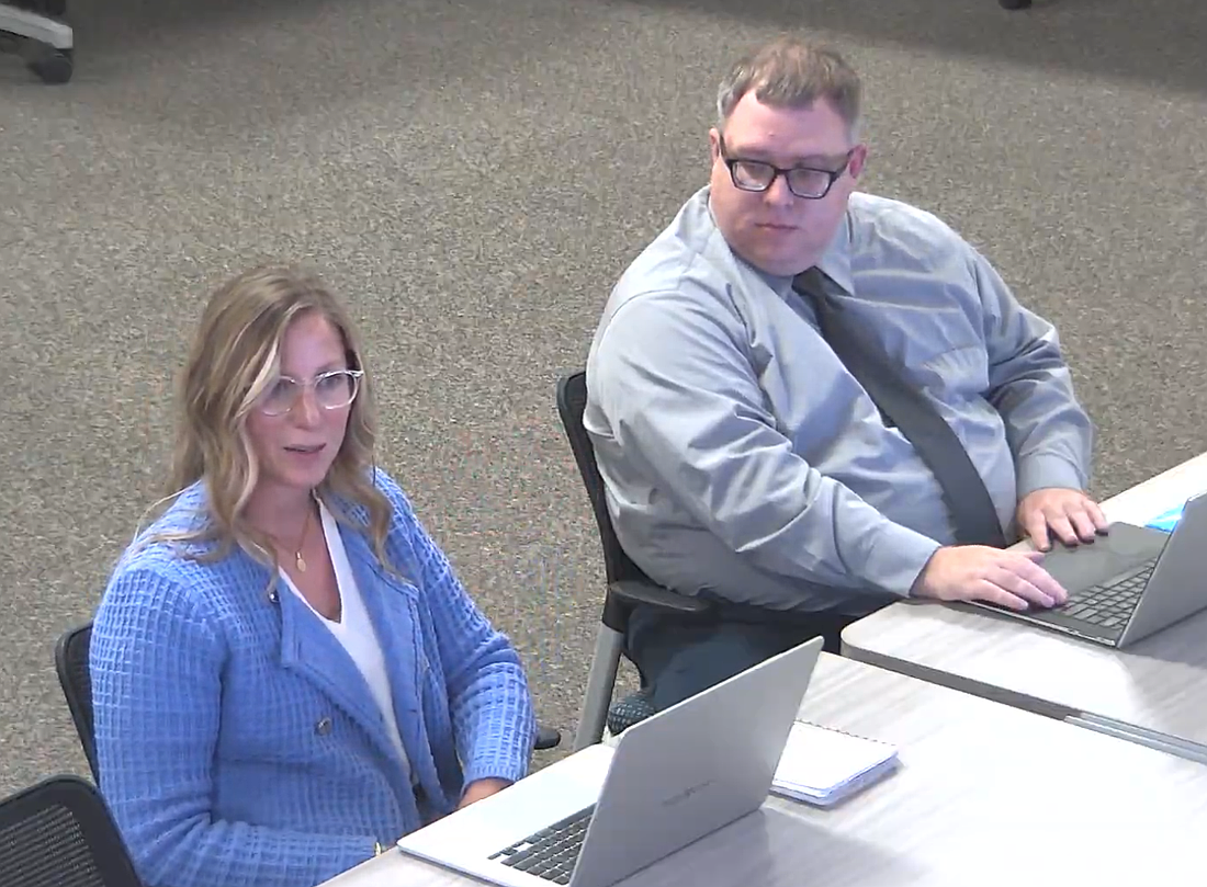 Assistant Superintendent Dr. Angela O'Brien and Scott Reynolds, the district's coordinator of assessment and accountability, present the preliminary outline for Flagler Schools' new three-year strategic plan. Image from Flagler Schools meeting video