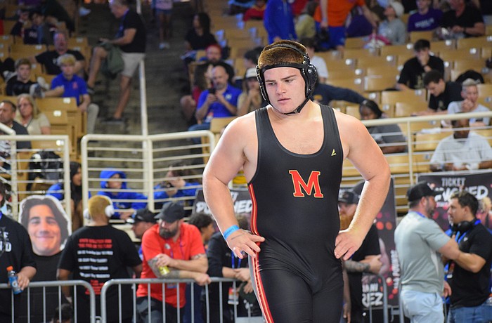 Blake Roulund was a defensive end/middle linebacker for Cardinal Mooney football as a junior. He committed to wrestling full-time for his senior year, forfeiting a chance to be part of a football state championship.