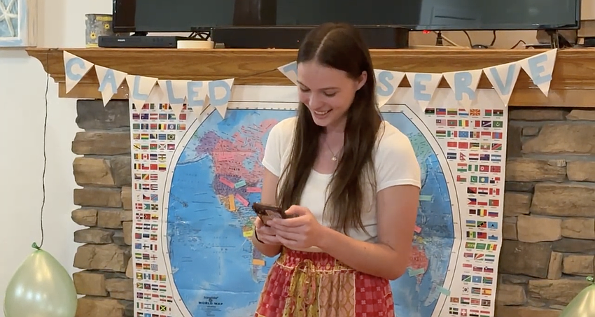 Keila Brouse, a graduate of Matanzas High School, opens her mission call in front of family and friends on March 6. Screenshot of Observer reel