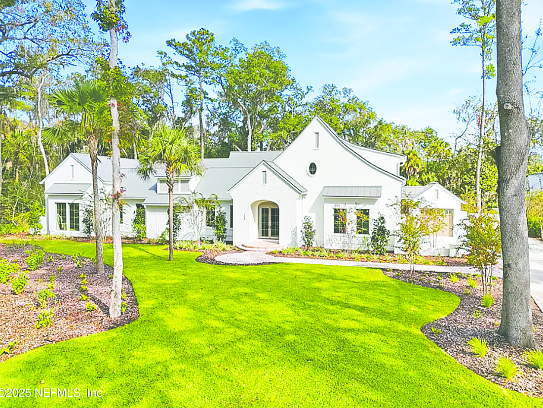 Intracoastal waterfront home has five bedrooms, four full and two half-bathrooms, guest suite, atrium, porches, pool and dock.