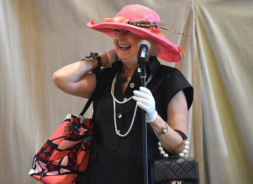 Andrea Burr, the president of the Lakewood Ranch Women's Club, welcomes guests to the 
