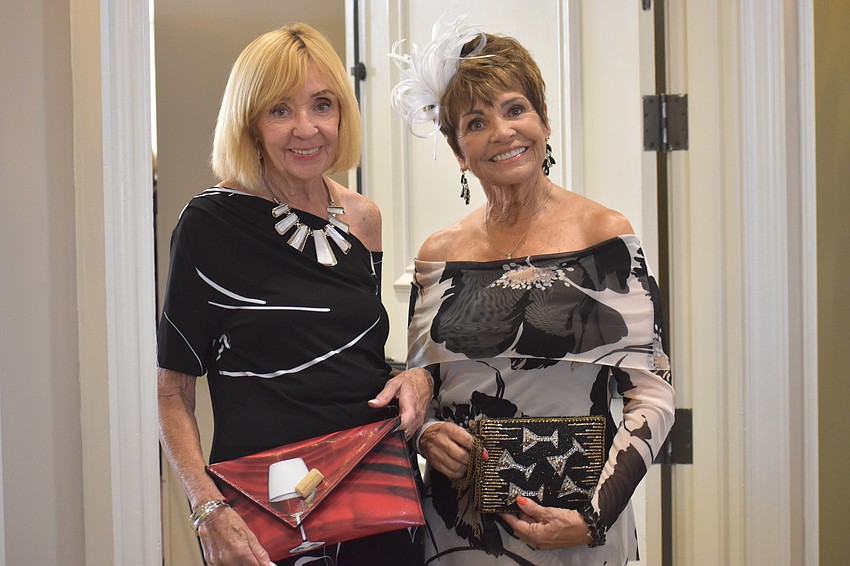 Regina Napoli and Row Cruikshank are among the models from the Lakewood Ranch Women's Club who walk the runway to raise money for charity.