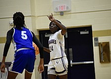 Yvette Brown directs the offense for Booker girls basketball Feb. 27 against DeSoto County in the FHSAA Class 4A-Region 3 championship. The Tornadoes outscored regional competition by an average of 31 points per game, but lost by 33 in the state semifinals.