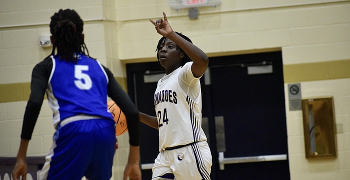 Yvette Brown directs the offense for Booker girls basketball Feb. 27 against DeSoto County in the FHSAA Class 4A-Region 3 championship. The Tornadoes outscored regional competition by an average of 31 points per game, but lost by 33 in the state semifinals.