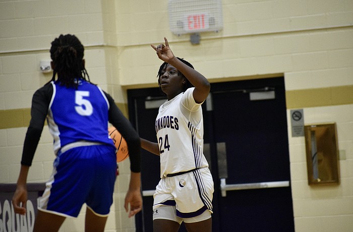 Yvette Brown directs the offense for Booker girls basketball Feb. 27 against DeSoto County in the FHSAA Class 4A-Region 3 championship. The Tornadoes outscored regional competition by an average of 31 points per game, but lost by 33 in the state semifinals.