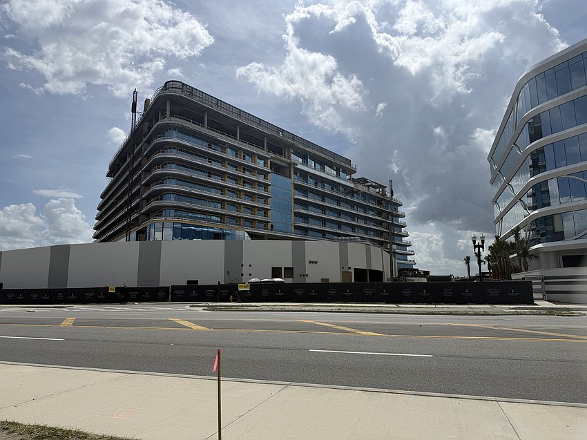 The Four Seasons Hotel and Private Residences, left, is shown under construction on March 9.