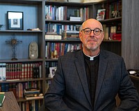 St. Armands Key Lutheran Church Pastor Ken Blyth poses for a photo in his office Tuesday, March 10, less than a week after he and a group of pastors had their pilgrimage to the Holy Land cut short as war erupted in the Middle East.