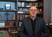 St. Armands Key Lutheran Church Pastor Ken Blyth poses for a photo in his office Tuesday, March 10, less than a week after he and a group of pastors had their pilgrimage to the Holy Land cut short as war erupted in the Middle East.