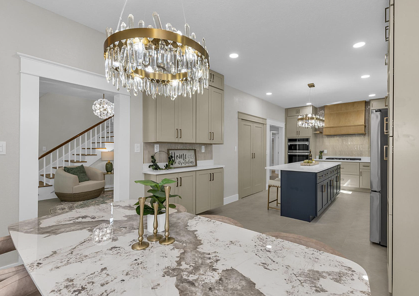 A quartz-surface island is the centerpiece of the kitchen.