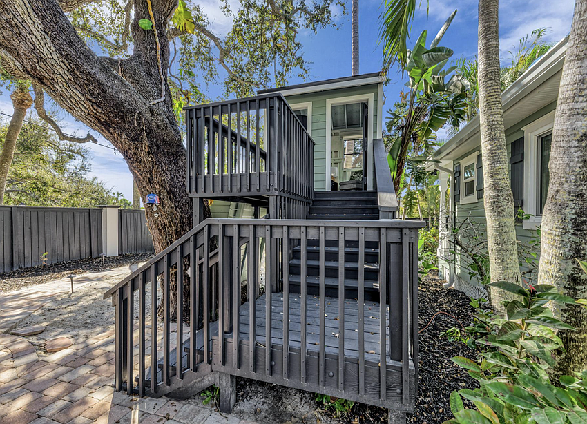 The treehouse in the back yard is wired for electricity, and a city-allowed chicken coop is nearby.