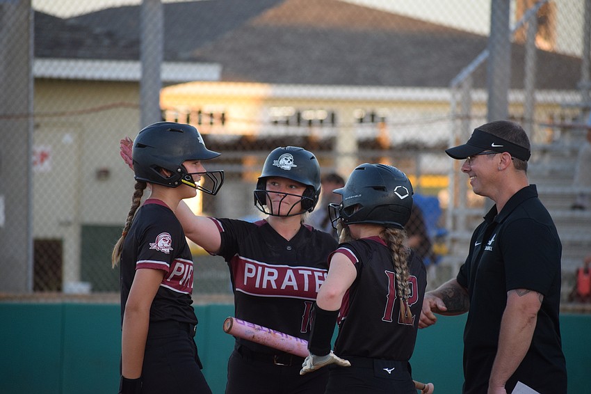 From left: freshman shortstop Evelyn Paul, freshman infielder/pitcher Cady Jones, freshman third baseman/catcher Cooper Jones and coach Keith Jans. Four of the Pirates' top-six hitters, as of March 10, are freshmen.