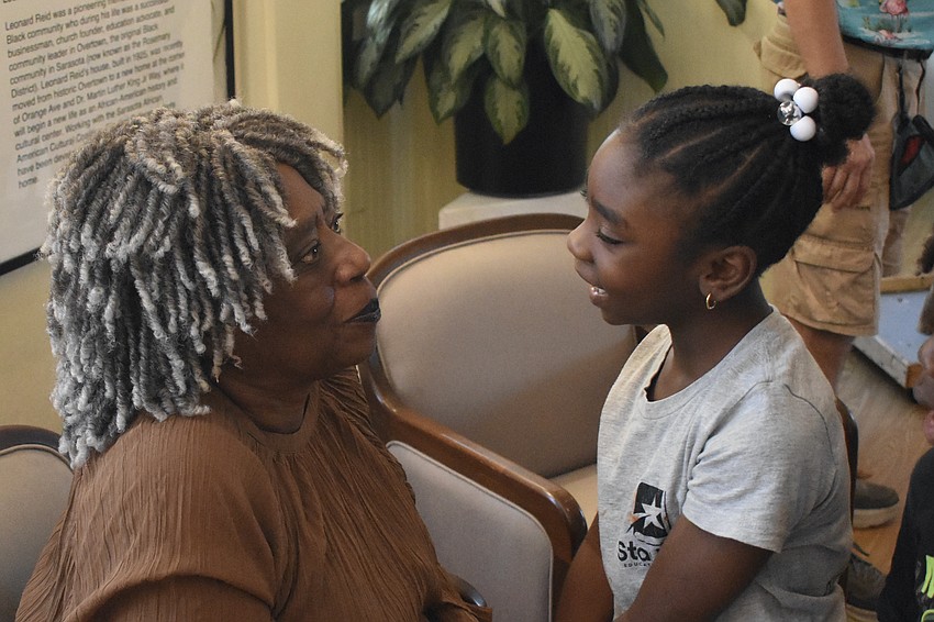 Rose Solomon greets Japan Hill, a second grader at Star Lab.