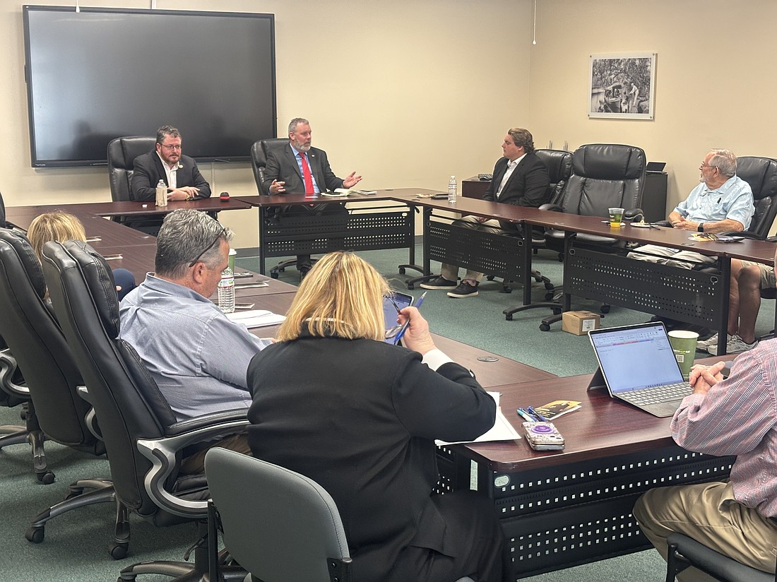 Mayor Jason Leslie speaks during the roundtable meeting with Rep. Randy Fine (left) on Thursday, March 12. In attendance were local business representatives, city staff and Edgewater Mayor Diezel Depew. Photo by Jarleene Almenas