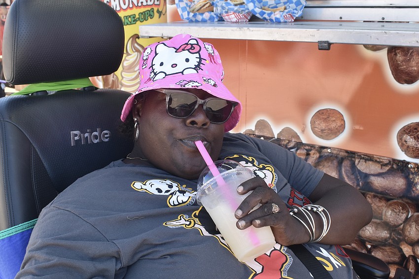 JoAnn Cook cools off at the Cubans and Reubens stand.