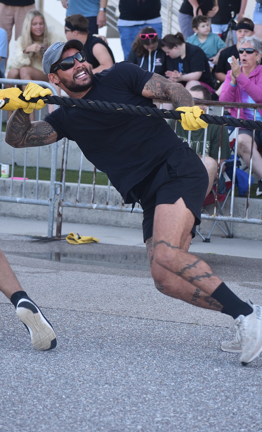 Nick Bermudez, a member of Team Holland, participates in the Bus Pull for Inclusion at Nathan Benderson Park on March 14.