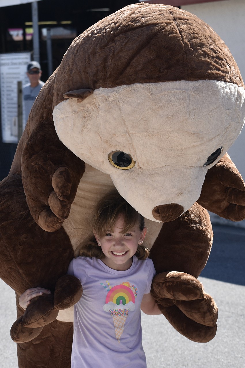 Zoey Gumienny, 7, carries home a new stuffed friend.