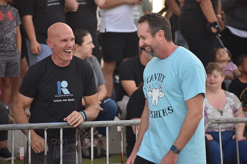 Founder of Inclusion Revolution Beaver Shriver shares a smile with Ken Rainey, who is a captain with the Sarasota Police Department.